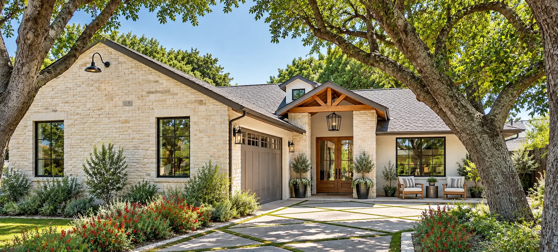 A light stone family home with a landscaped front yard in Ohio